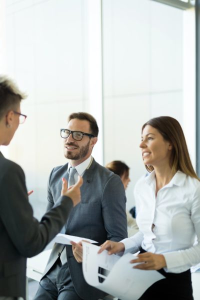 Picture of business colleagues talking in office